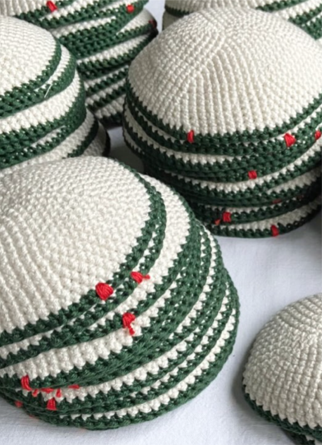 Stacked Penelope D cream kippot with forest-green edging