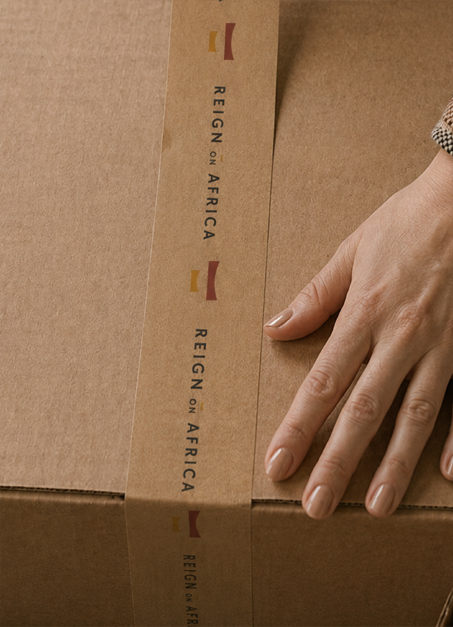Reign On Africa branded kraft packaging tape on a cardboard box
